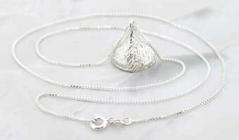 VINTAGE STERLING SILVER KISS CANDY PENDANT AND BOX CHAIN